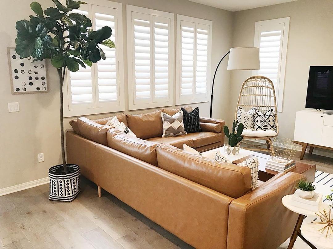 Warm living room with Polywood shutters in New Brunswick.